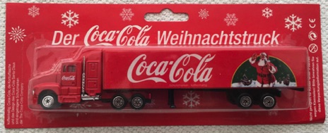 10131-3 € 6,00 coca cola vrachtwagen kerstman staand in de sneeuw 18 cm (2x zonder doos).jpeg